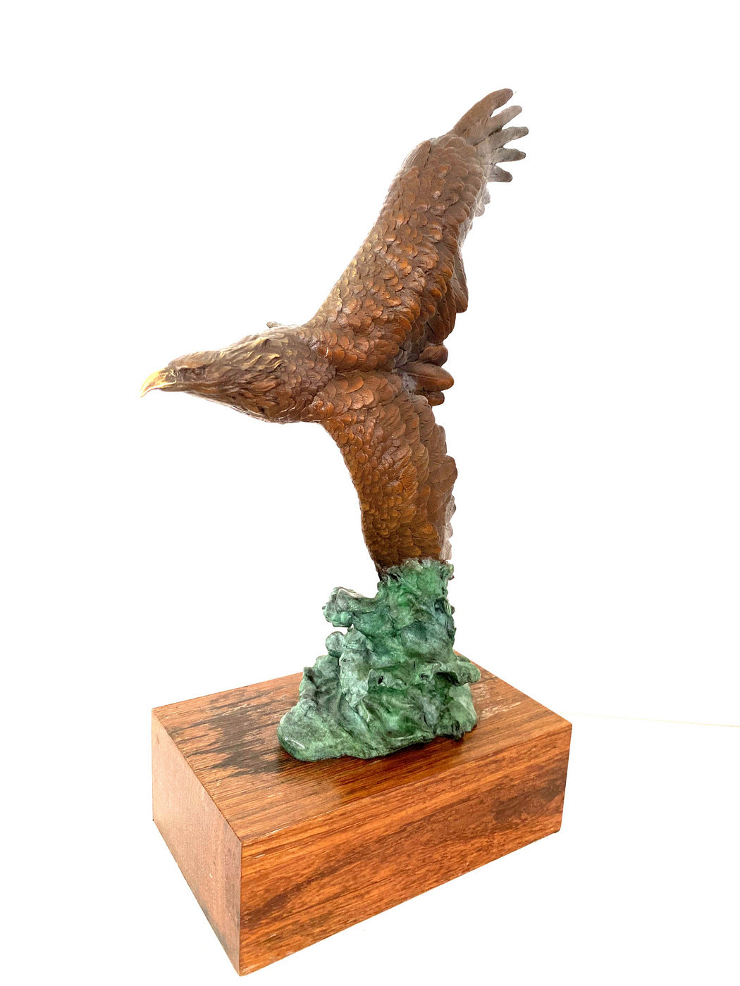 Bronze eagle on wooden base with artist signature