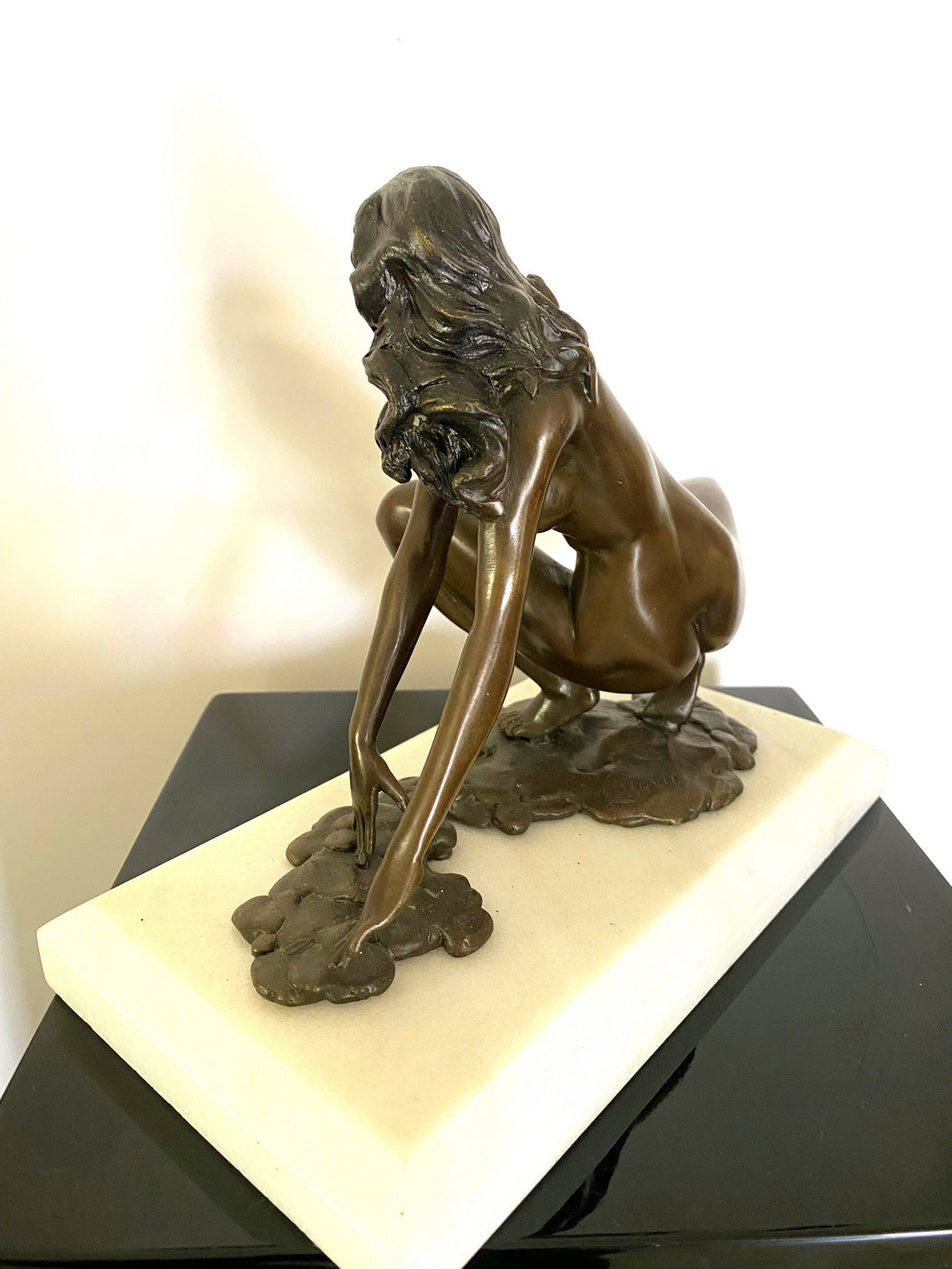 Bronze nude with artist signature on white marble base