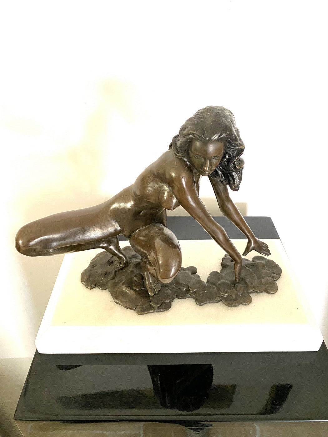 Bronze nude with artist signature on white marble base