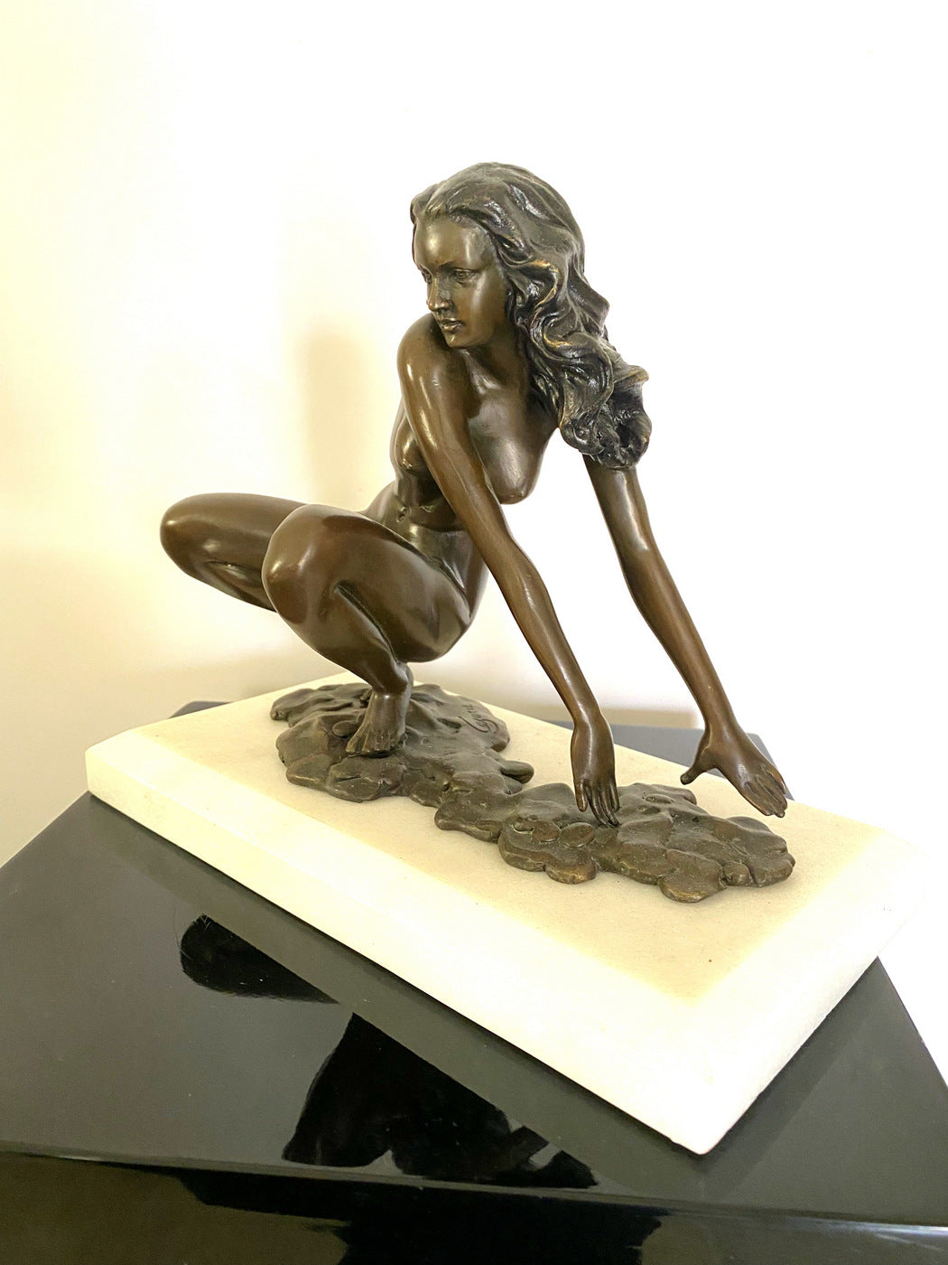 Bronze nude with artist signature on white marble base