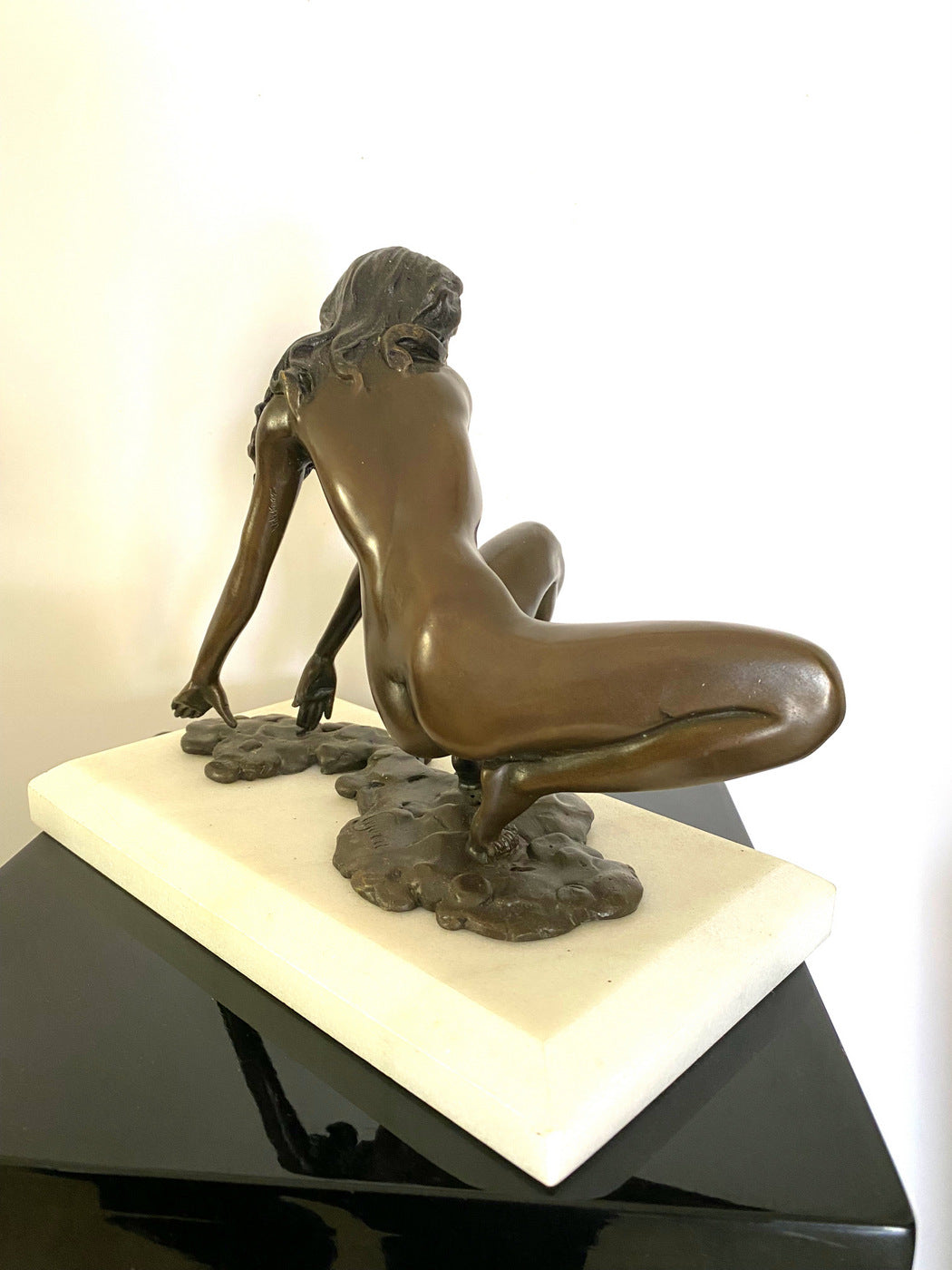 Bronze nude with artist signature on white marble base