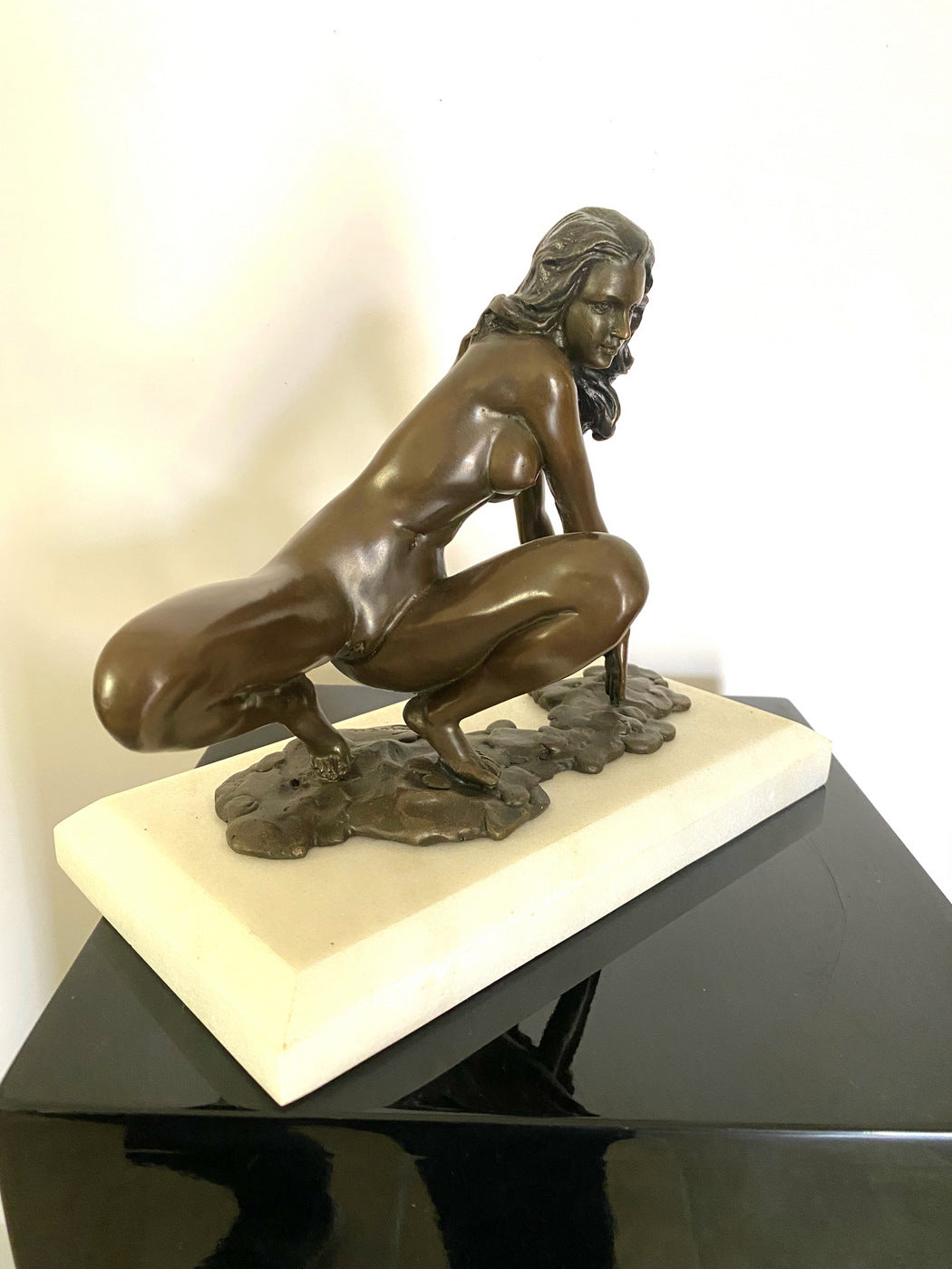 Bronze nude with artist signature on white marble base