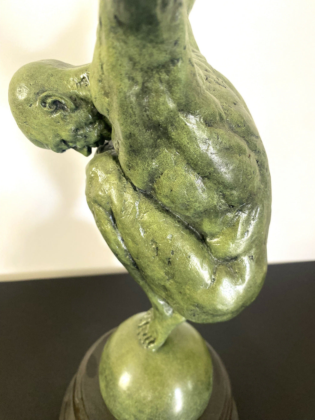 Athlete on ball signed Milo on marble base in bronze