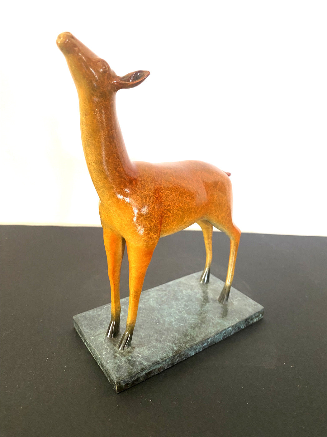 Bronze figure - deer on bronze plate with artist signature Milo