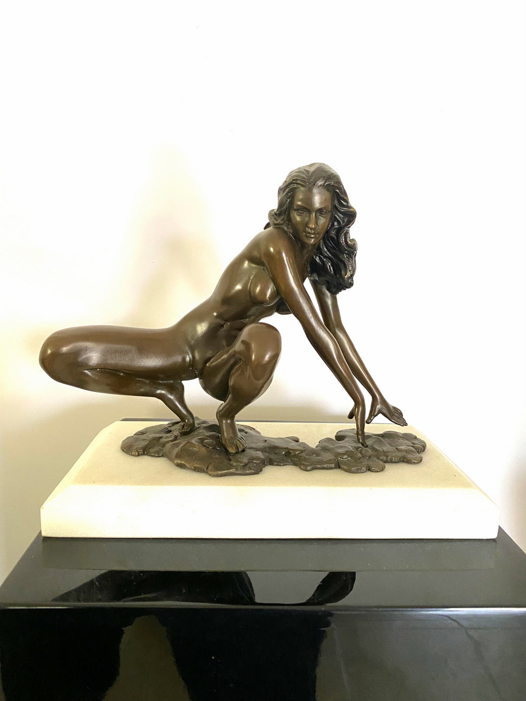 Bronze nude with artist signature on white marble base