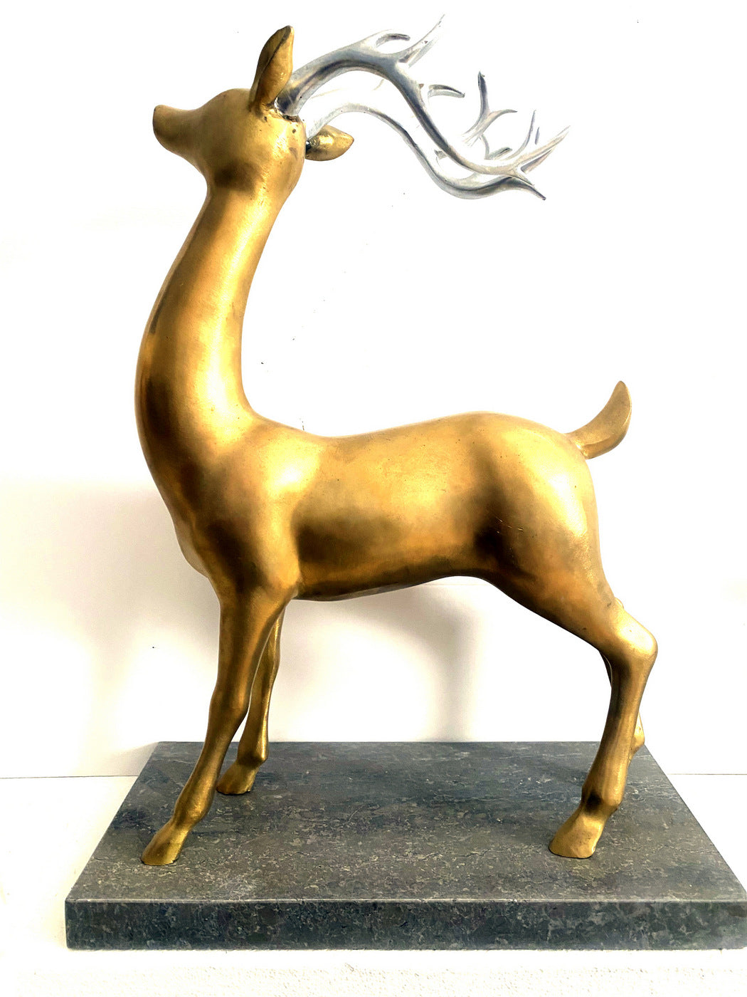 Bronze deer with silver antlers on marble base signed Milo