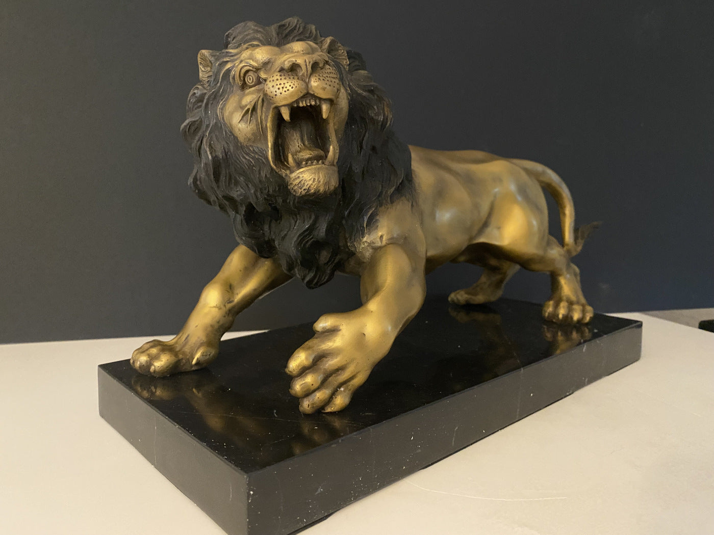 Animal bronze - lion on marble base with artist signature