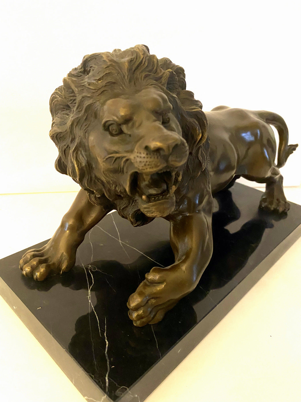 Animal bronze - lion on marble base with artist signature