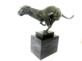 Bronze big cat sprinting on marble base with artist signature