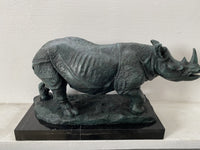 Large animal bronze rhinoceros on marble base with artist signature