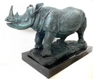 Large animal bronze rhinoceros on marble base with artist signature