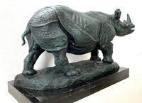 Large animal bronze rhinoceros on marble base with artist signature